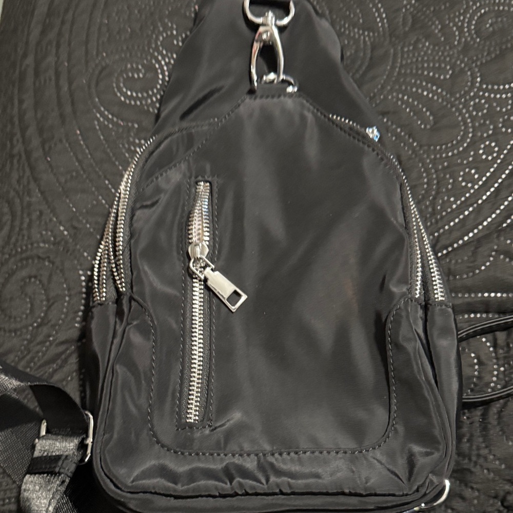 Sleek Black Womens  Backpack with Silver Zippers